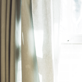 4 Ways to Keep Your Pleated Curtains From Seeming Dated article image